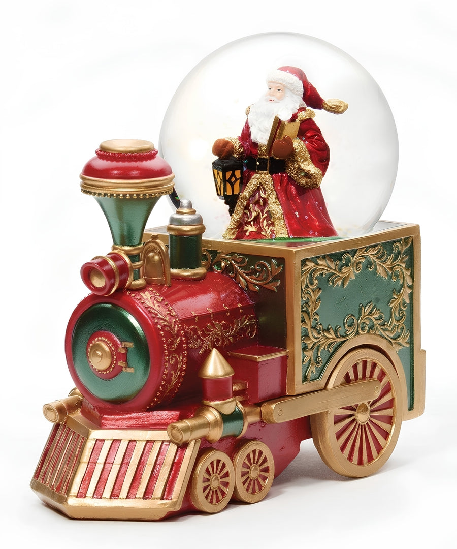 A festive Christmas snow globe featuring a red and gold train engine with a Santa Claus figurine inside a clear glass globe, set against a plain white background.