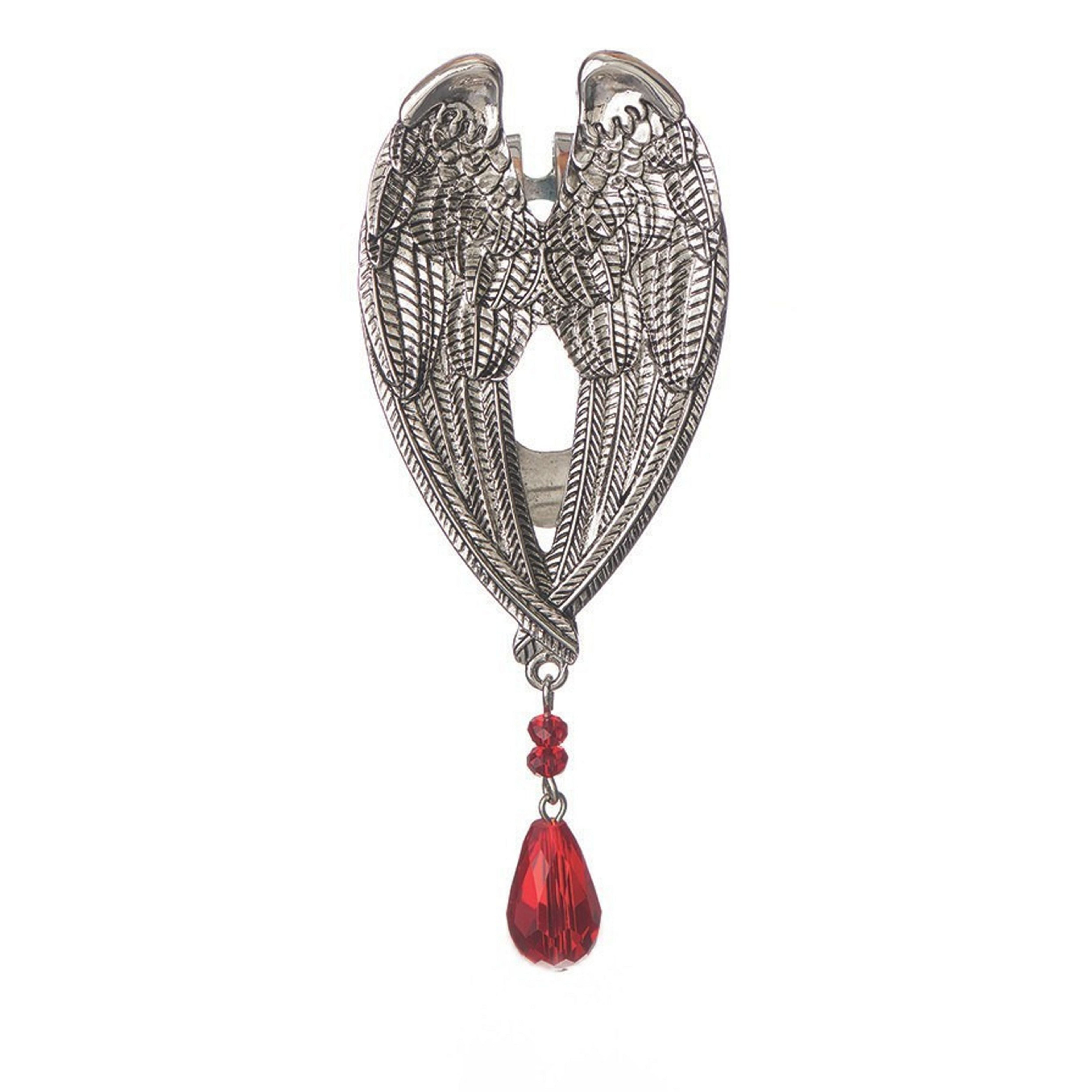 Silver winged brooch with a red gemstone on a white background