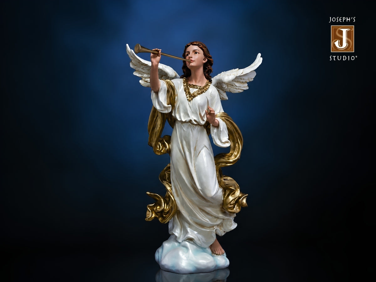 A detailed angel statue in a white robe with gold accents and white wings, holding a trumpet, set against a dark blue studio background. The Joseph's Studio logo is visible in the top right corner.