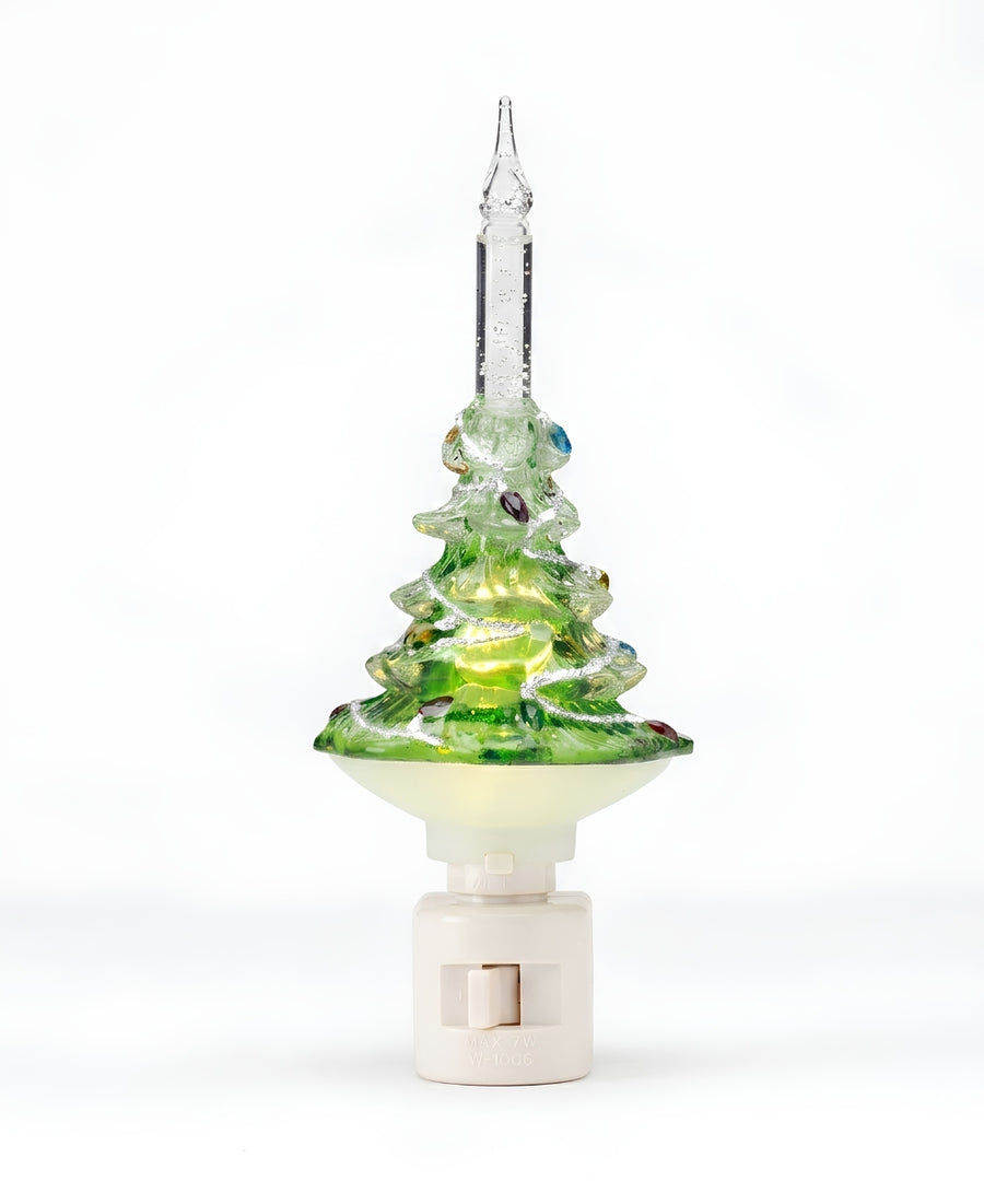 A glass Christmas tree night light with a green and yellow marbled tree design, a clear glass star topper, and a white plastic plug-in base, shown on a white background.